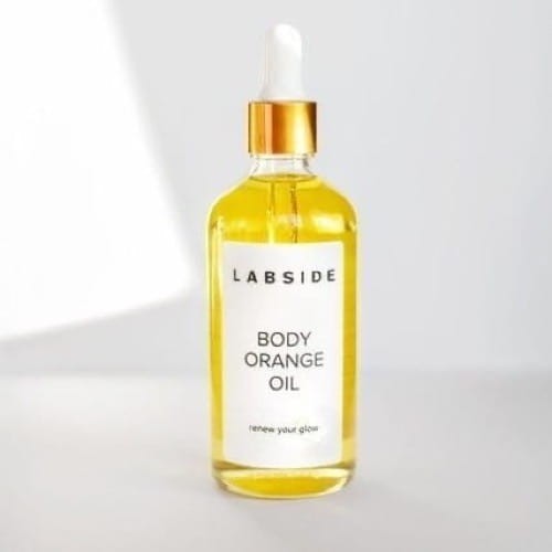 Szklana buteleczka z rozświetlającym olejkiem pomarańczowym Body Orange Oil marki Labside